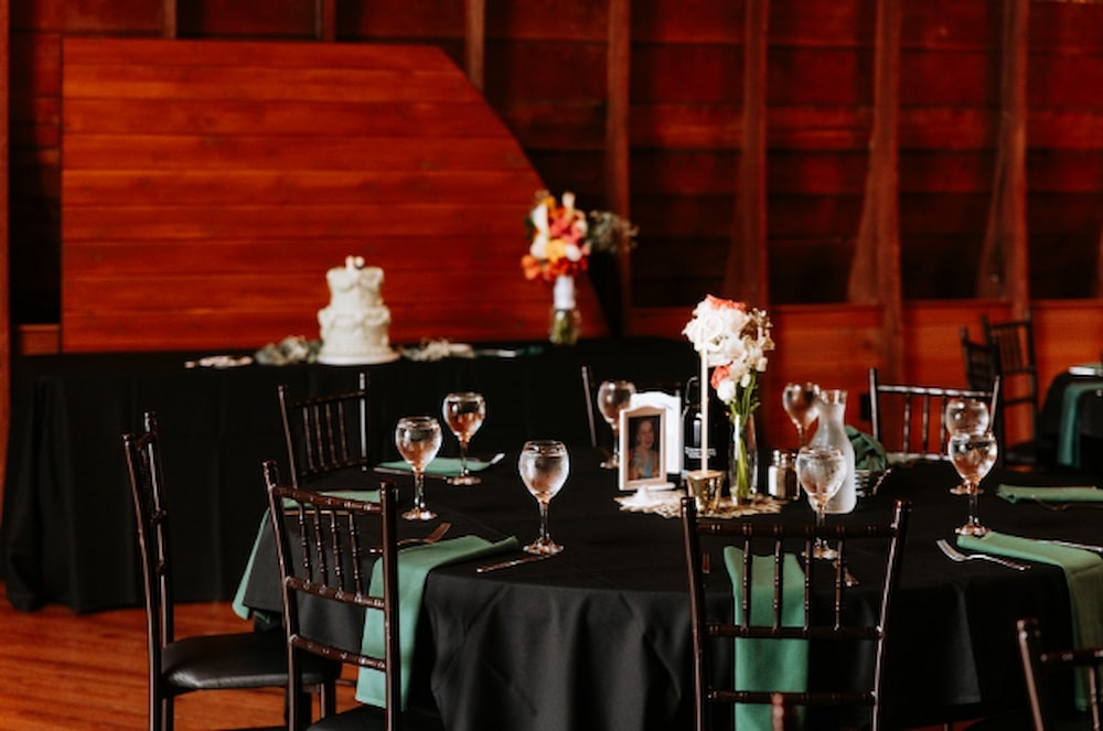 Tables setup for a wedding at Green Acres Event Venue - Wedding Styles